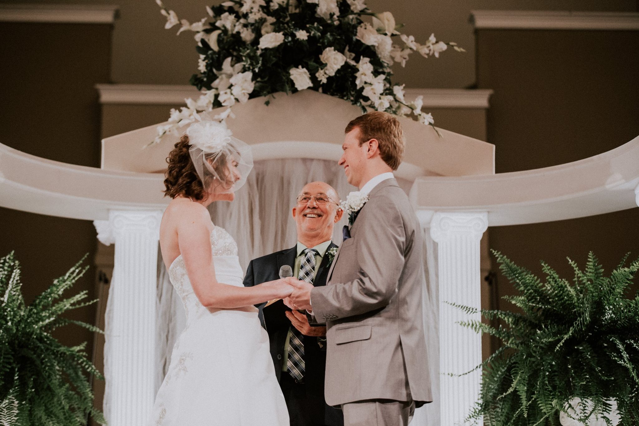 More than just a ring photo of bride and groom during ceremony